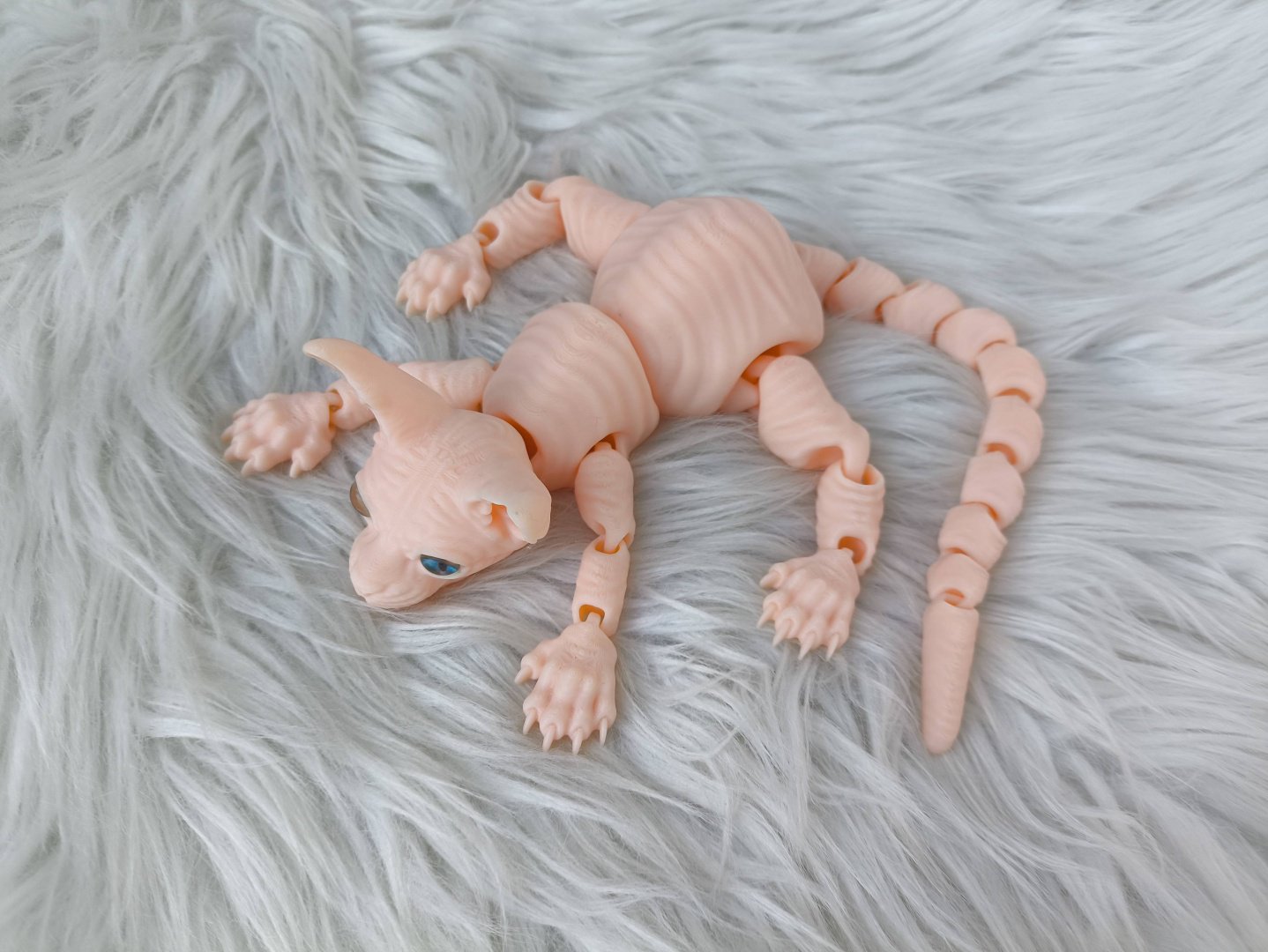 Подвижная игрушка Кошка Сфинкс 3д игрушка-антистрес розовый