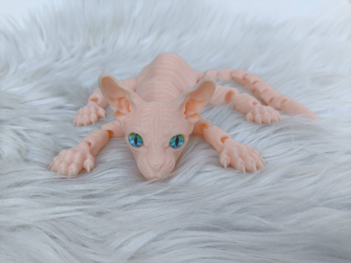 Подвижная игрушка Кошка Сфинкс 3д игрушка-антистрес розовый