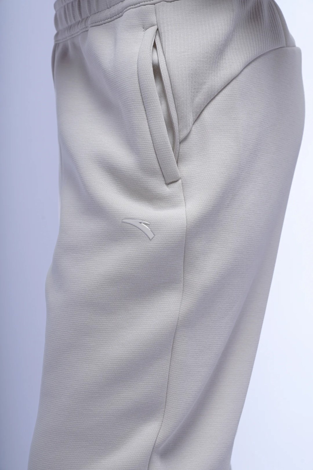 Спортивные брюки Anta 862537322N-3 бежевые XS 42-44