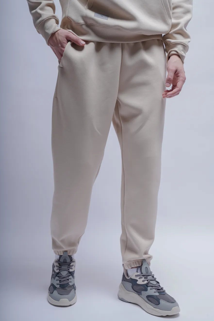Спортивные брюки Anta 852517317-3 бежевые XXL 54-56