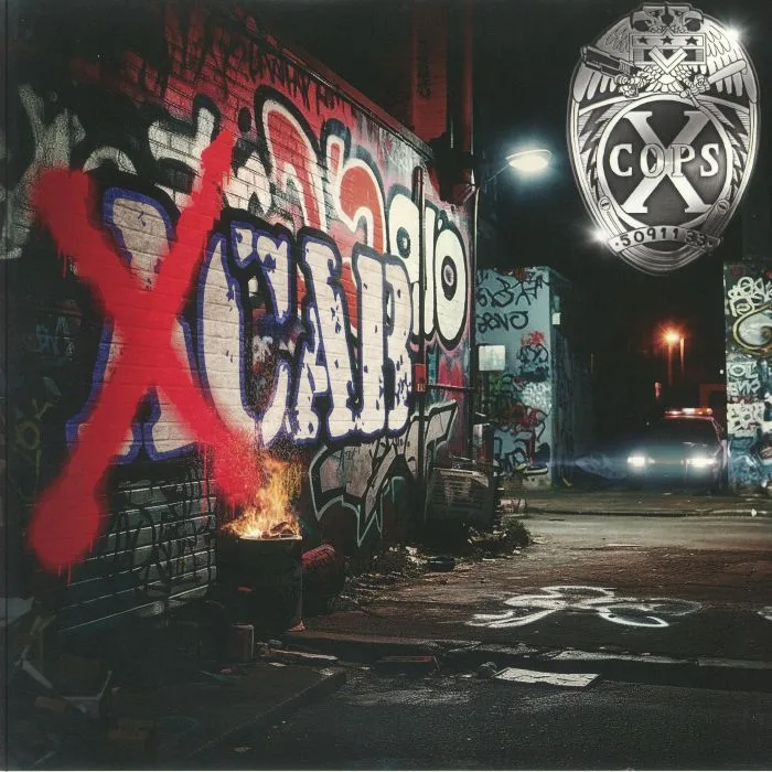 X COPS — XCAB